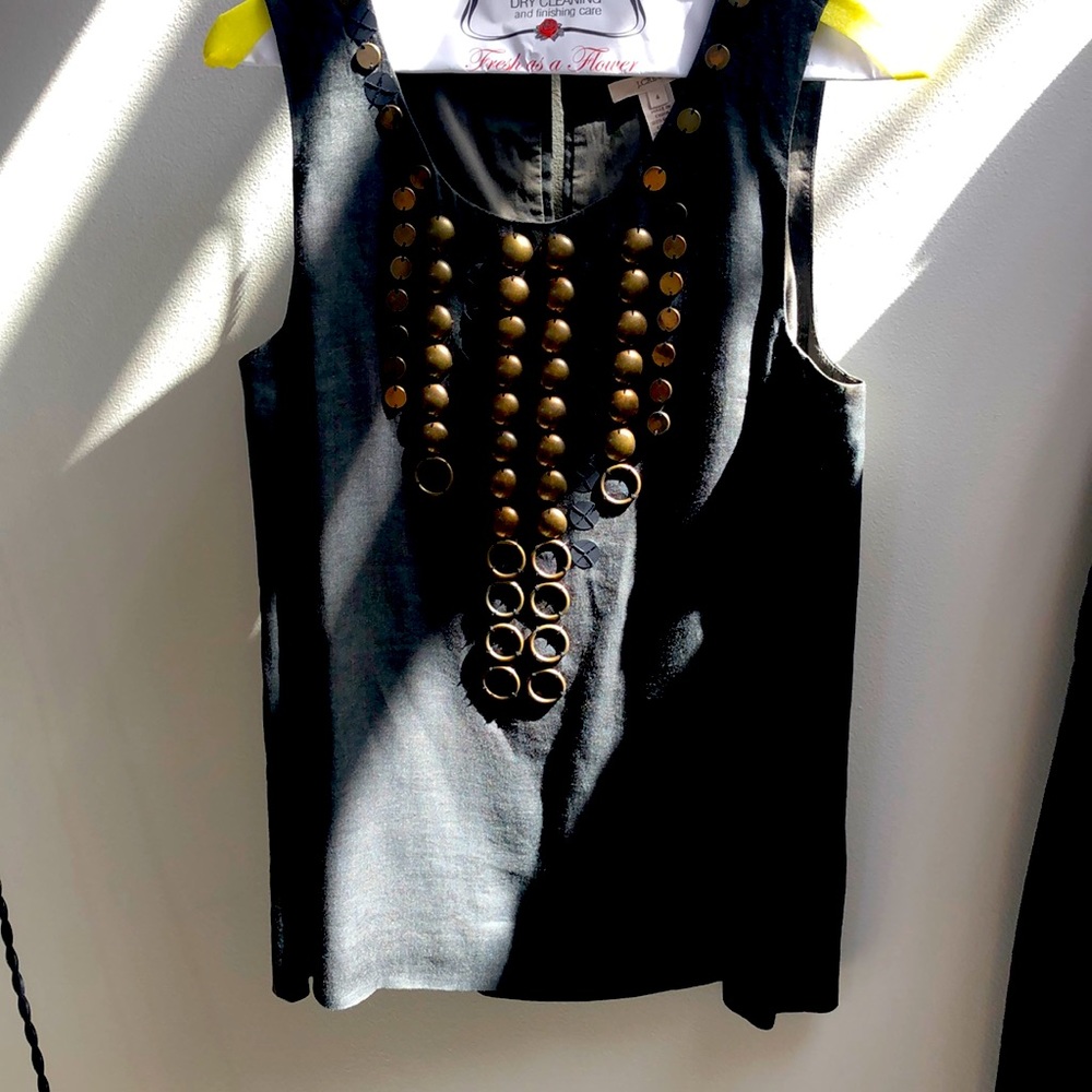 Gray top with brass details